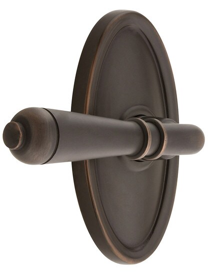 Oval Rosette Set With Turino Levers Left Hand in Oil Rubbed Bronze.